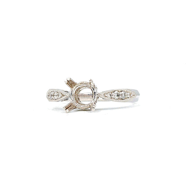 platinum semi mounting 8 round brilliant diamonds equals to .12ctw holds up to 6.5mm to 7mm stone