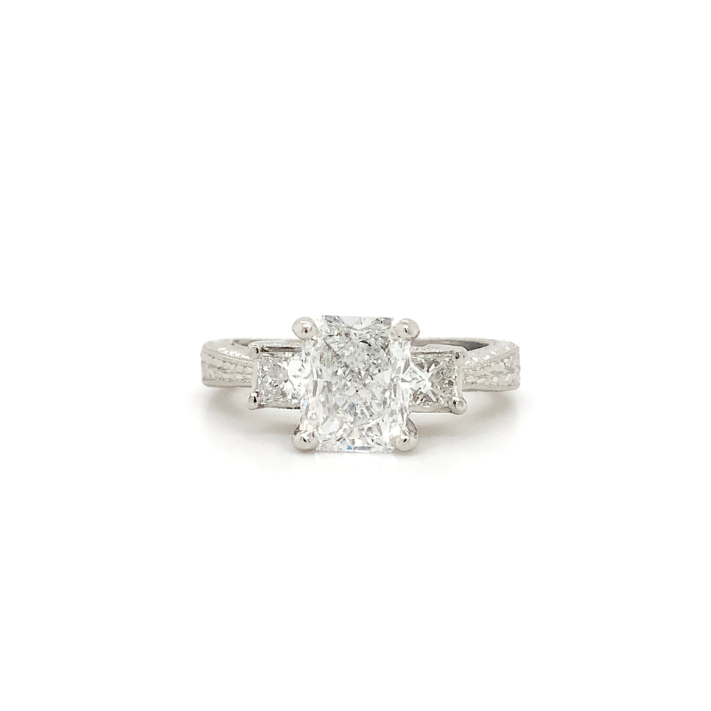 hand engraved 3 stone platinum and 18karat gold diamond 2.06 cts. tw. engagement ring .