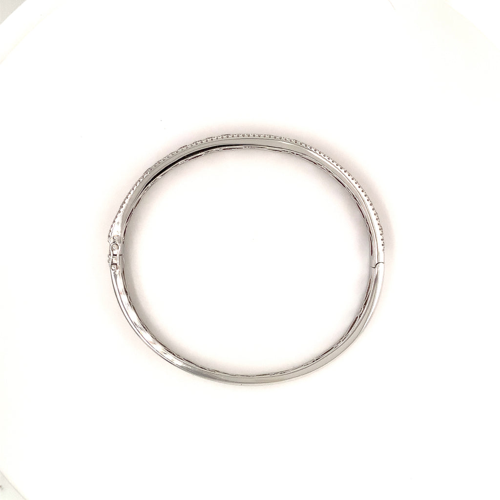 fine burmese princess cut ruby and diamond bangle bracelet in 18 kt white gold.
