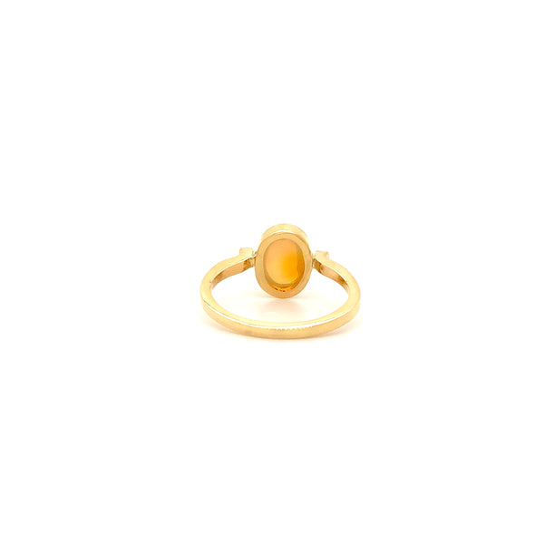 hand made petite fine crystal opal bezel set ring. set in 18k yellow gold