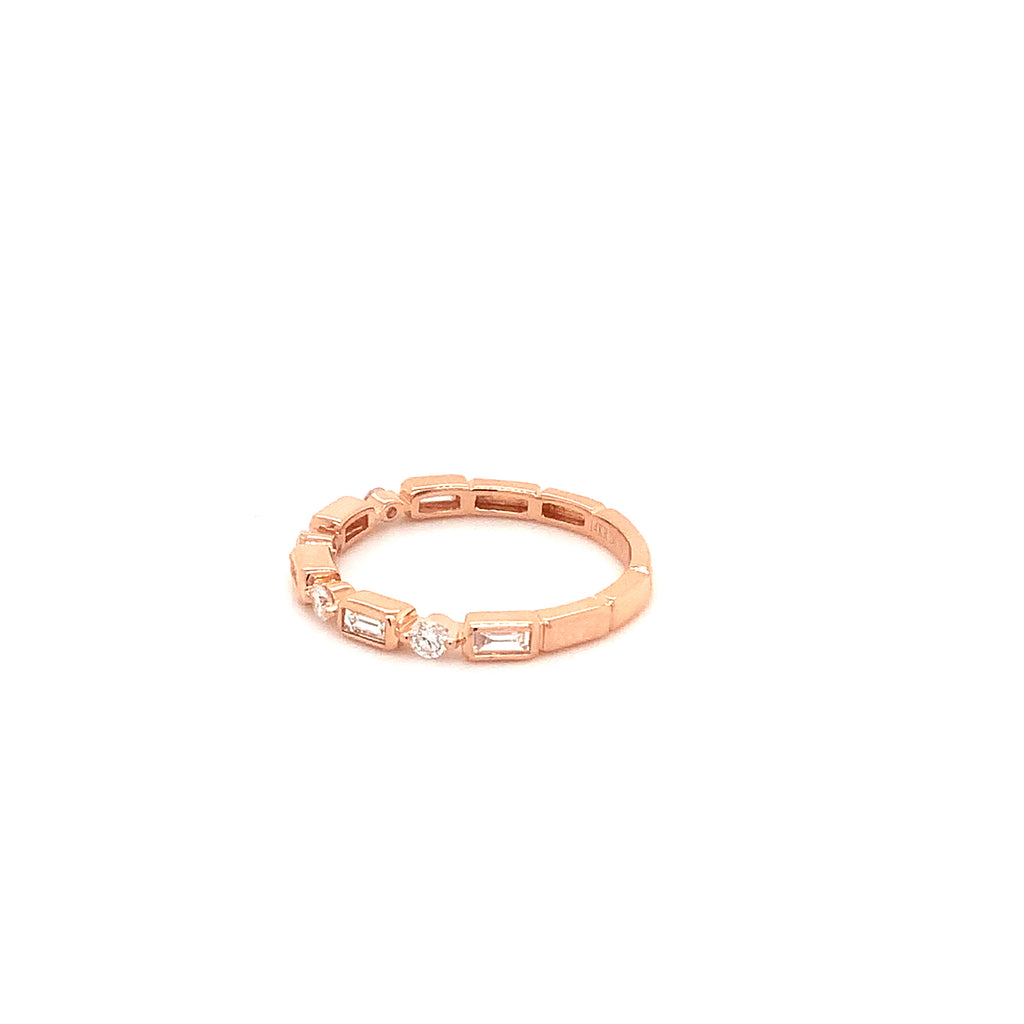 stackable  baguette and brilliant cut diamond band set in 14 kt rose gold.