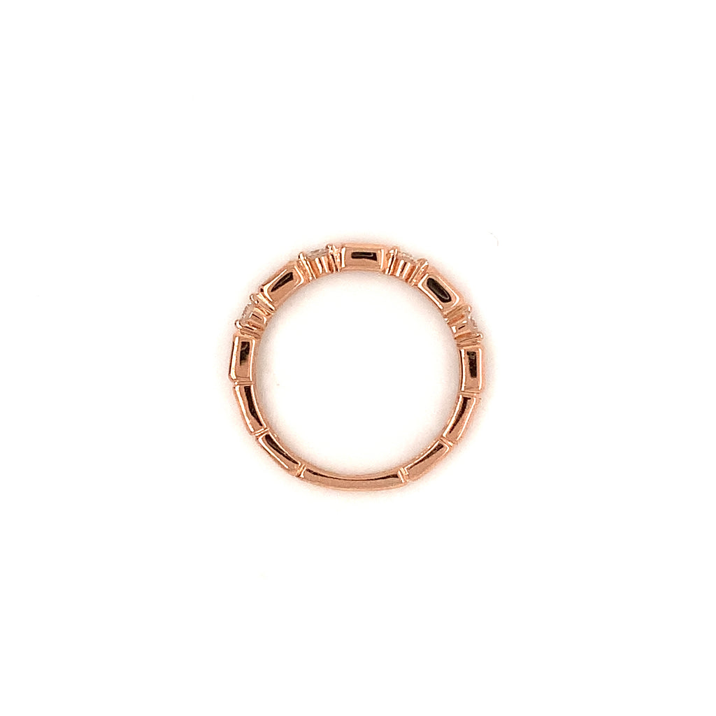 stackable  baguette and brilliant cut diamond band set in 14 kt rose gold.