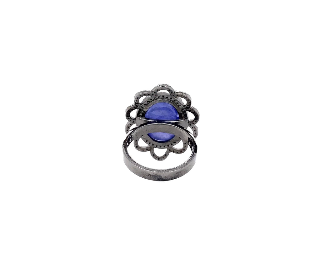 large oval cabochon tanzanite and diamond ring in oxidized sterling silver.