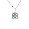 blue sapphire and diamond cushion shaped pendant in 18 kt white gold.