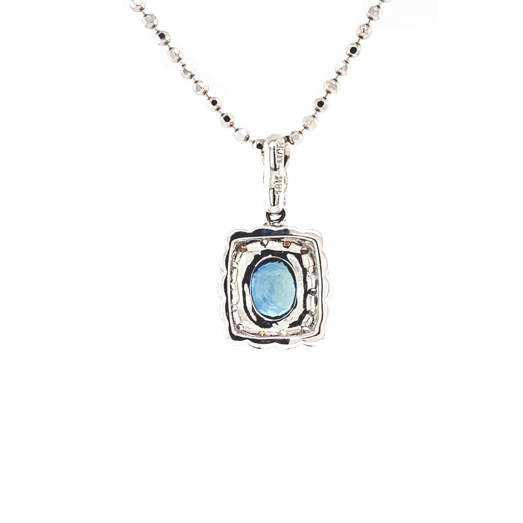 blue sapphire and diamond cushion shaped pendant in 18 kt white gold.