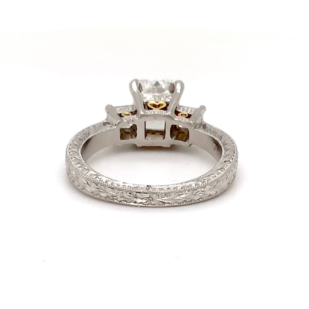 hand engraved 3 stone platinum and 18karat gold diamond 2.06 cts. tw. engagement ring .