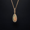 asba collection natural crystal pear-shaped opal pendant with diamond halo in 14k yellow gold