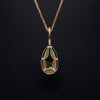 asba collection natural crystal pear-shaped opal pendant with diamond halo in 14k yellow gold