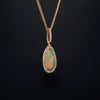 asba collection natural crystal pear-shaped opal pendant with diamond halo in 14k yellow gold