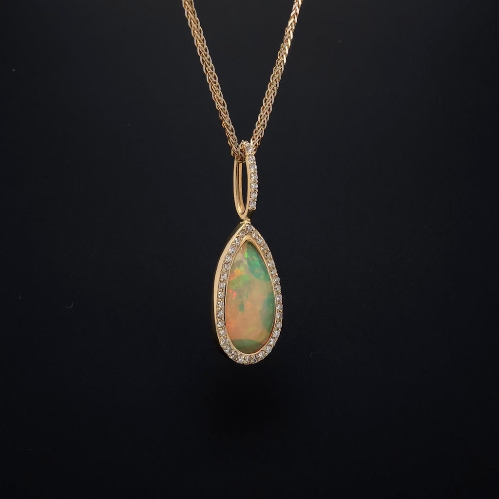 asba collection natural crystal pear-shaped opal pendant with diamond halo in 14k yellow gold