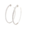 cz inside-out hoop earrings in gold color with secure lock