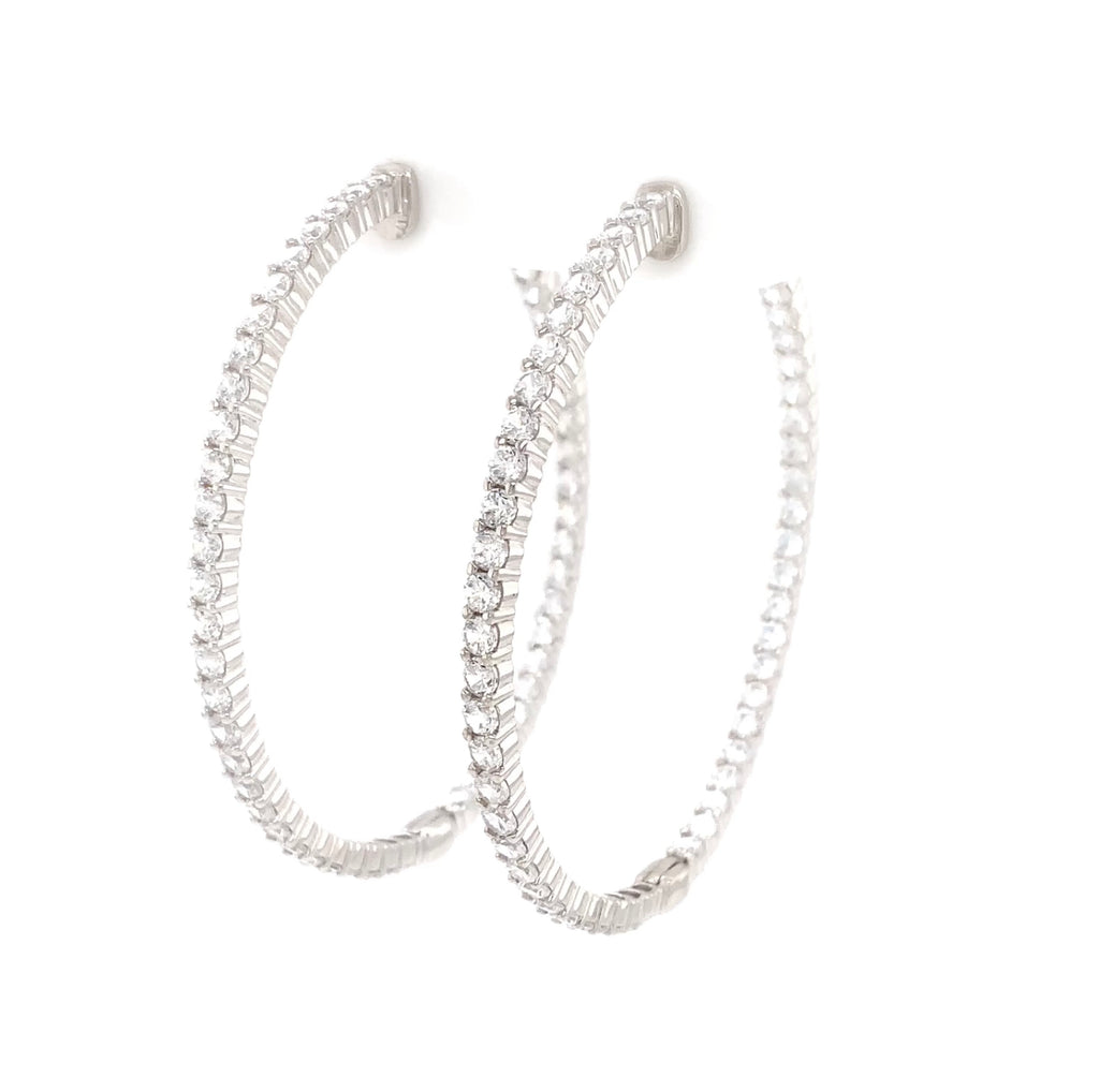 cz inside-out hoop earrings in gold color with secure lock