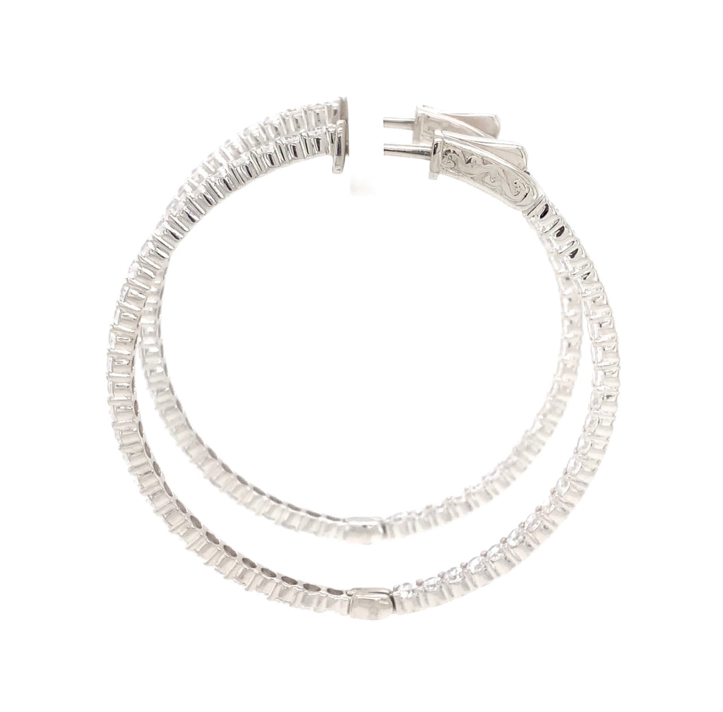 cz inside-out hoop earrings in gold color with secure lock