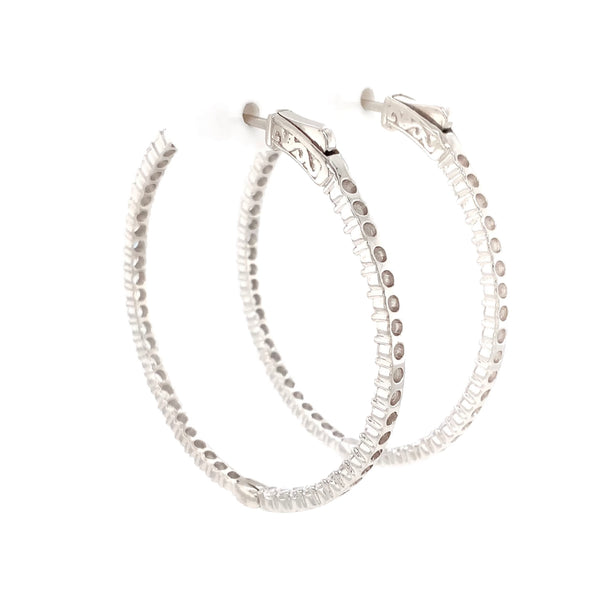 cz inside-out hoop earrings in gold color with secure lock