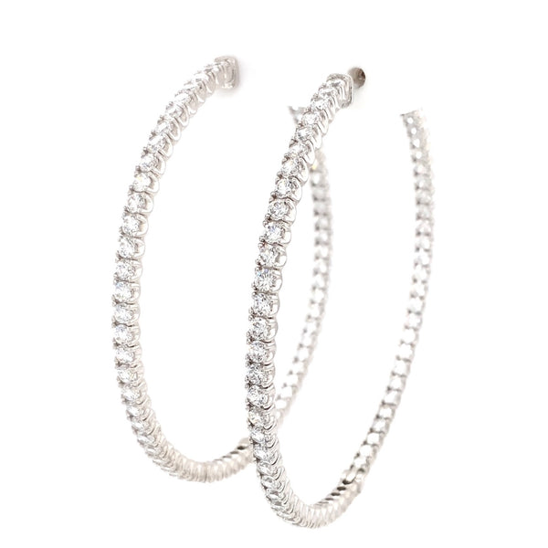 cz inside-out hoop earrings in gold color with secure lock