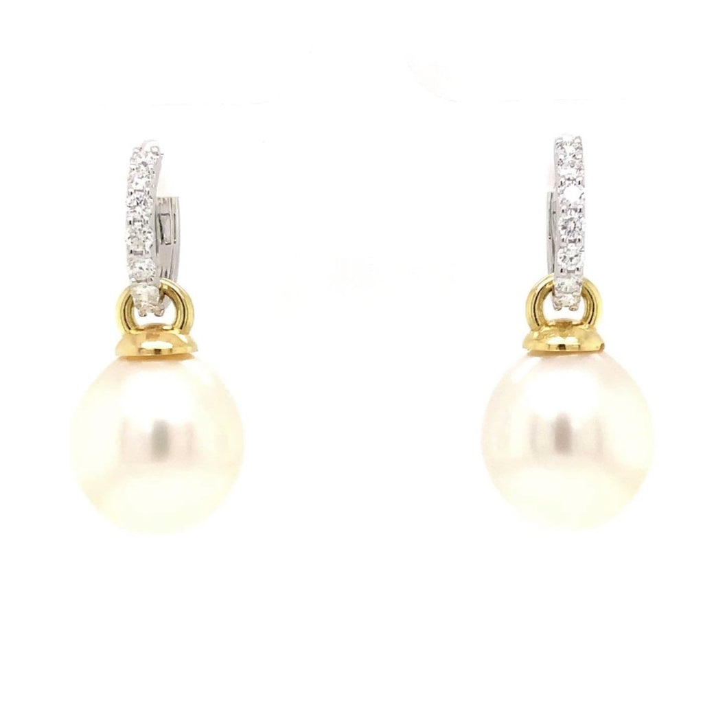 large oval drop papalsey cultured 15 mm white south sea pearl and diamond huggie earring.18 karat white and yellow gold.
