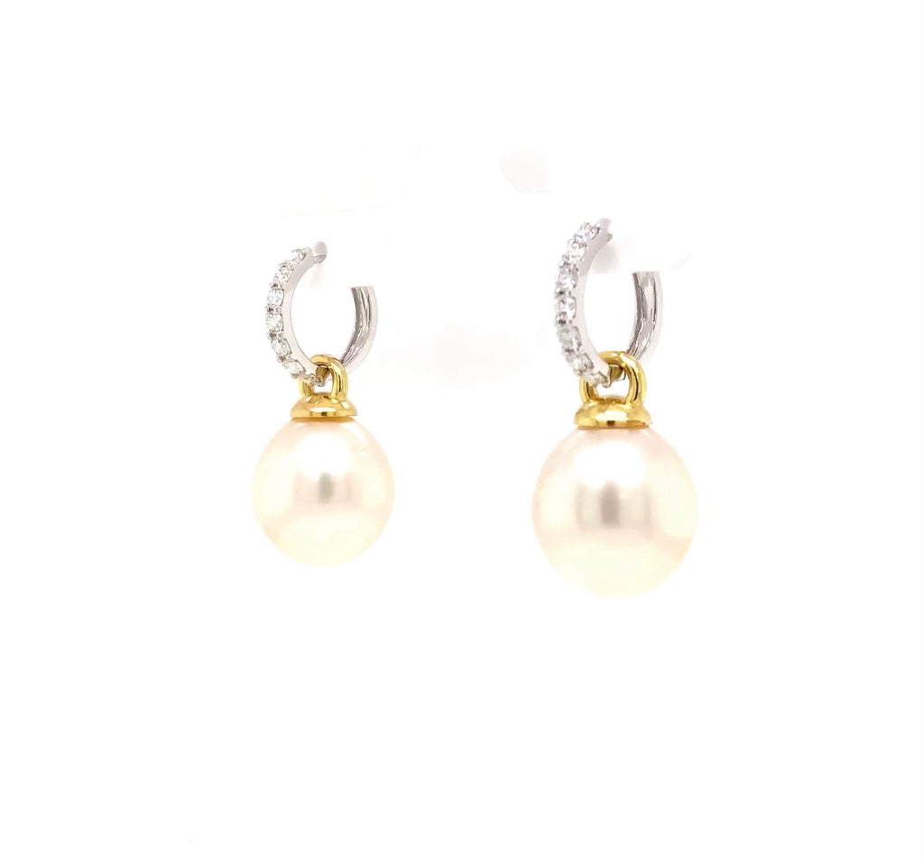 large oval drop papalsey cultured 15 mm white south sea pearl and diamond huggie earring.18 karat white and yellow gold.