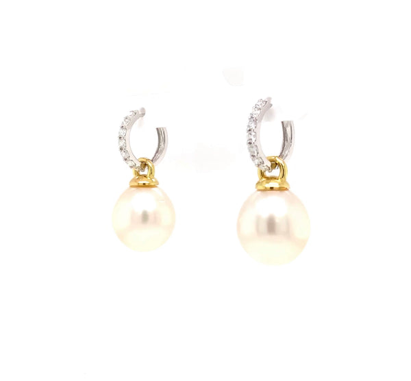 large oval drop papalsey cultured 15 mm white south sea pearl and diamond huggie earring.18 karat white and yellow gold.