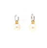 large oval drop papalsey cultured 15 mm white south sea pearl and diamond huggie earring.18 karat white and yellow gold.