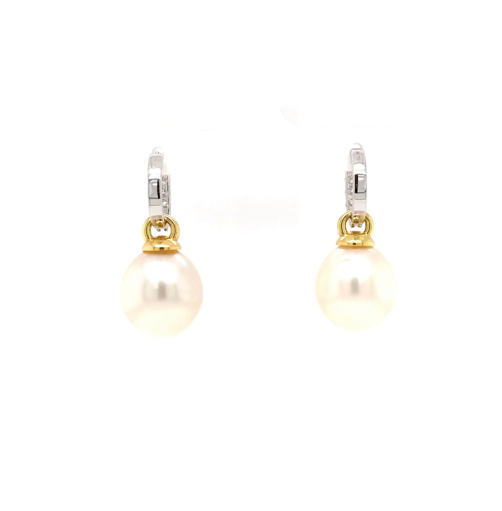 large oval drop papalsey cultured 15 mm white south sea pearl and diamond huggie earring.18 karat white and yellow gold.