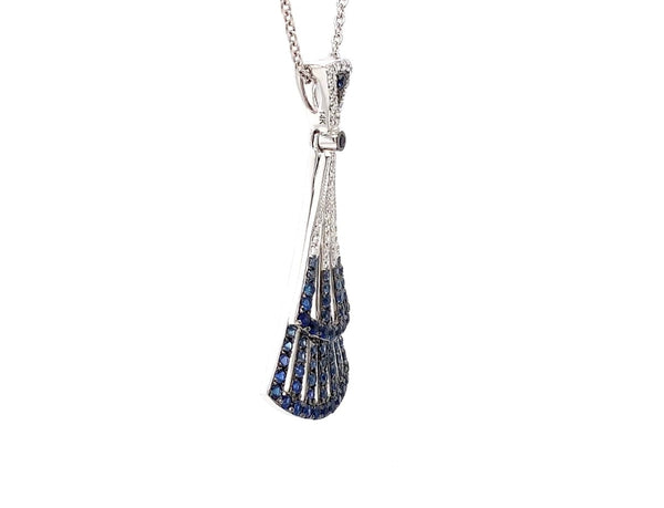 blue sapphire and diamond paved lavalier pendant in 14 kt white gold.