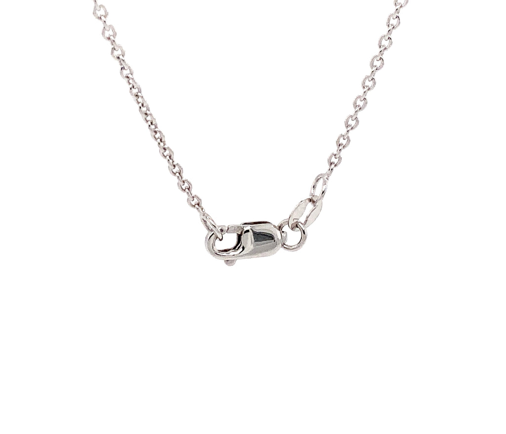 blue sapphire and diamond paved lavalier pendant in 14 kt white gold.