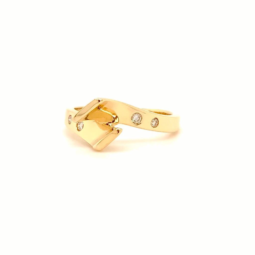 modern diamond channel set bi- pass semi mounting in 14 kt yellow gold by dioro.