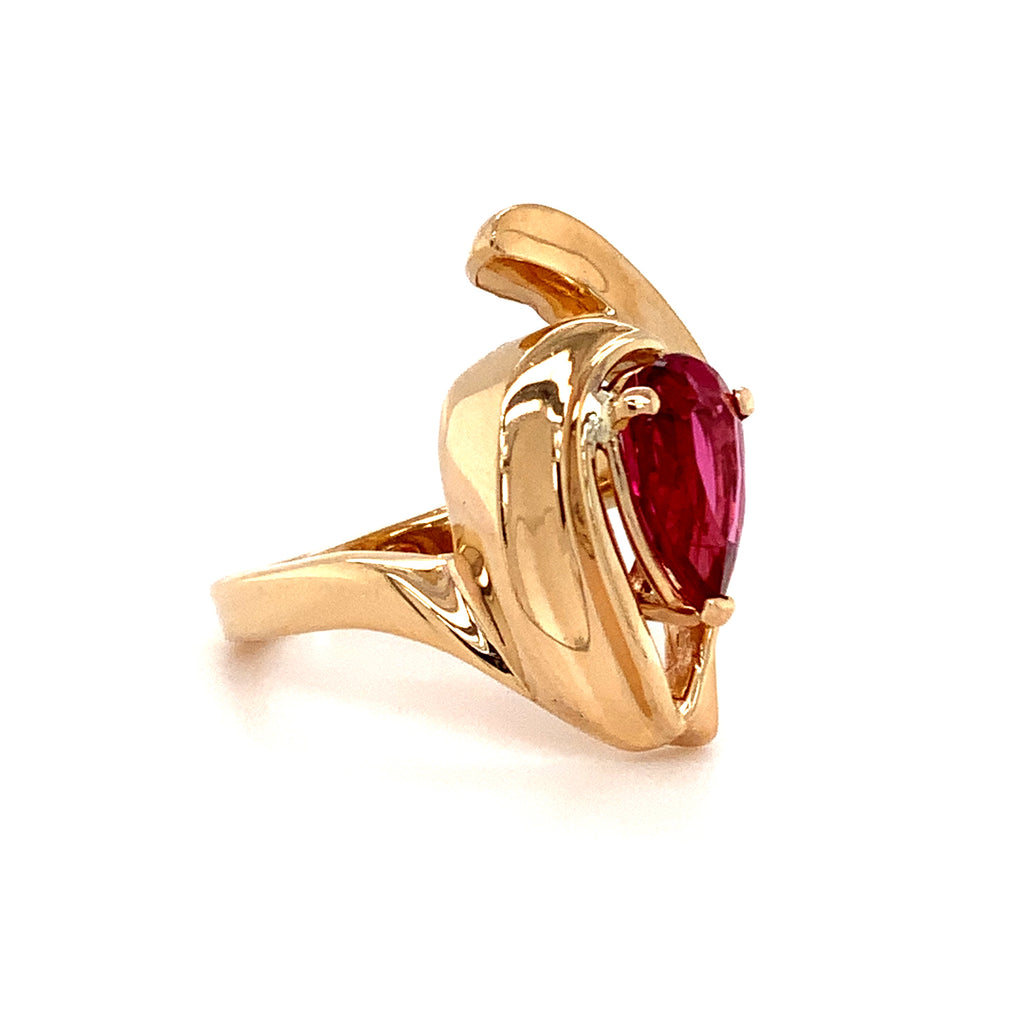 pear shape pink tourmaline (rubelite) and diamond ring in 14 kt yellow gold.