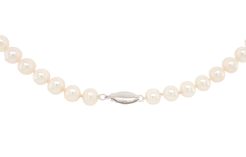white freshwater pearl and diamond drop necklace.