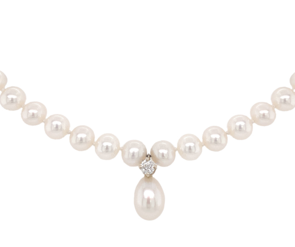 white freshwater pearl and diamond drop necklace.