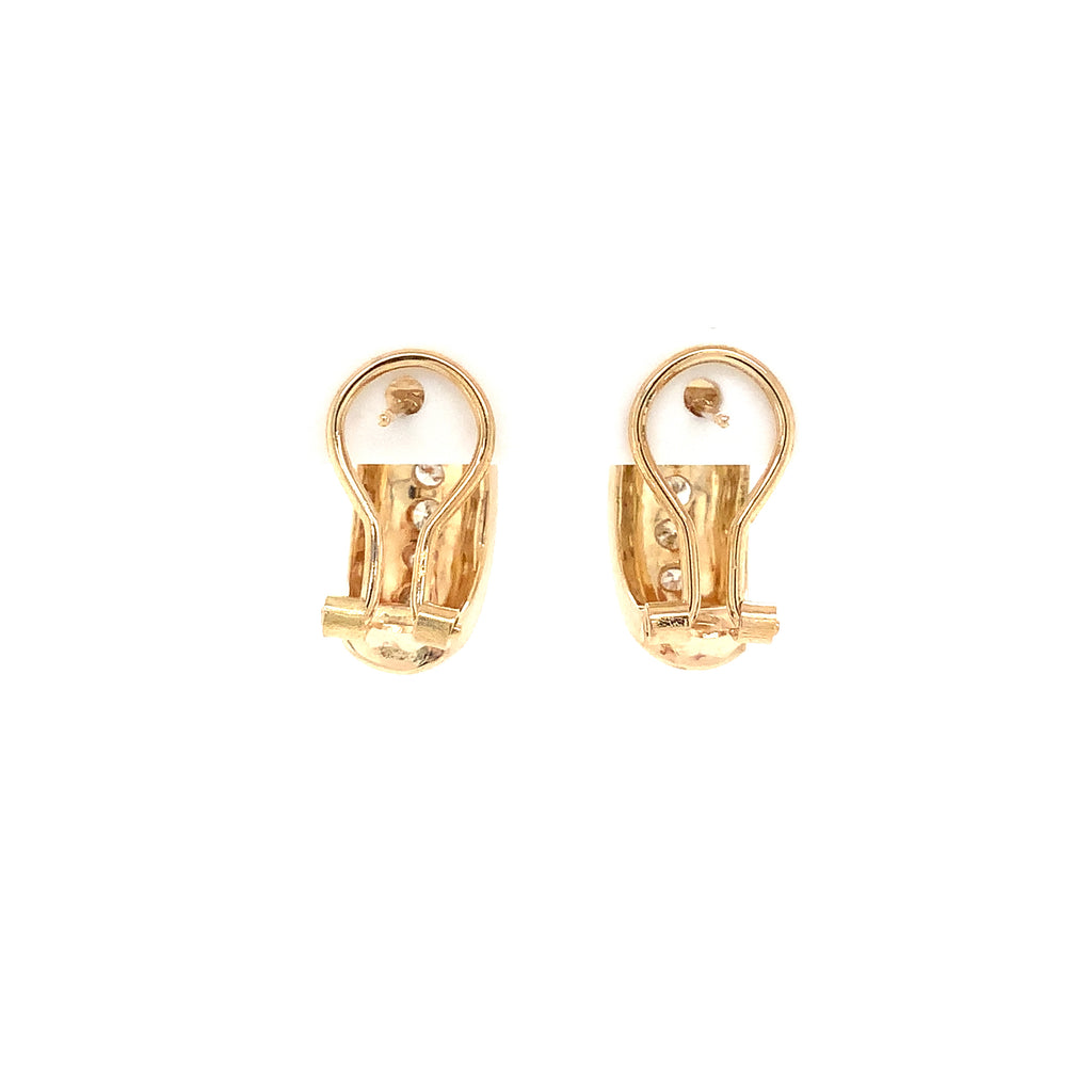 modern pave set diamond hoop earrings in 14kt yellow gold with omega clips.