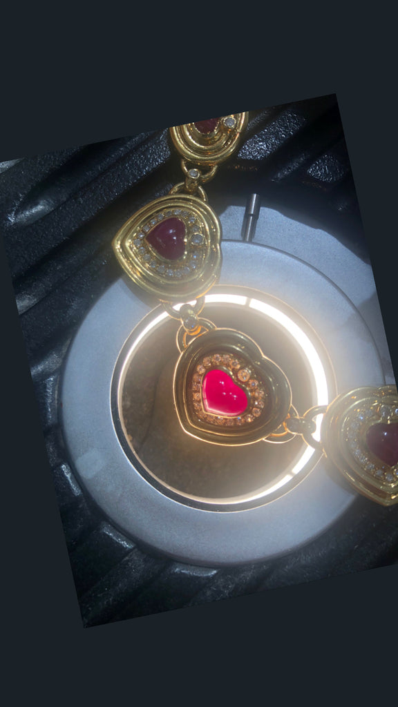 seven hearts shaped ruby and diamond necklace 18k yellow gold panther link chain.
