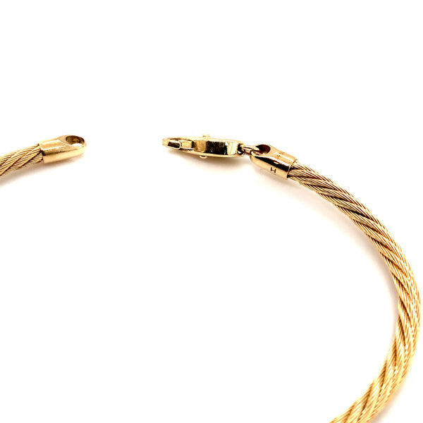 bangle style twisted mesch cable  bracelet in 14 kt yellow gold with a lobster clasp